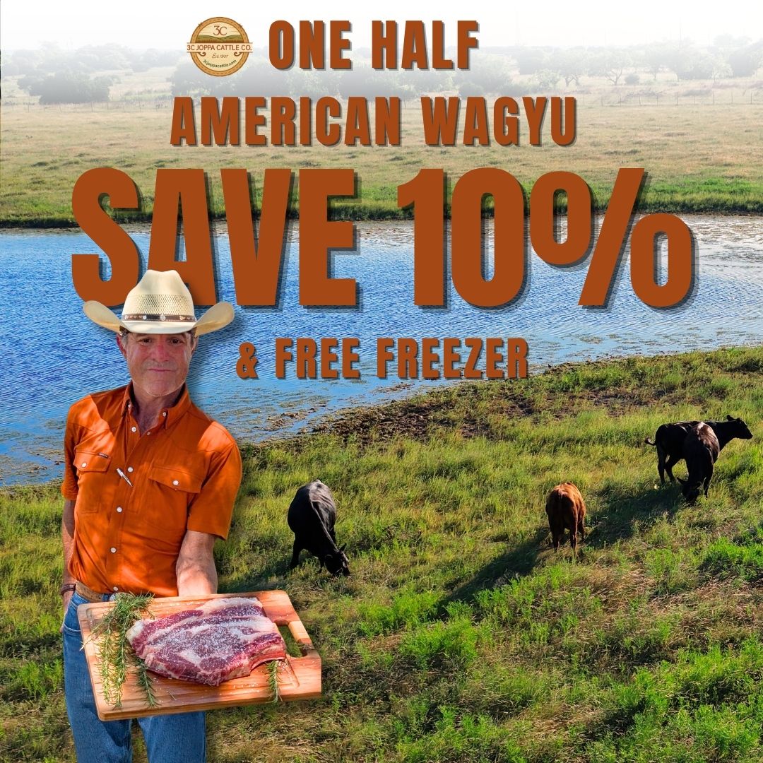 A promotional graphic for 'One Half American Wagyu' featuring a man in a cowboy hat holding a raw wagyu cut on a wooden board, set against a rural landscape with cows and large text reading 'SAVE 10% & FREE FREEZER'.