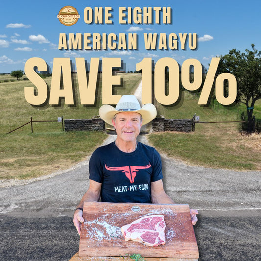 A man in a cowboy hat stands outdoors holding a wooden cutting board with a raw steak, with large promotional text reading 'ONE EIGHTH AMERICAN WAGYU SAVE 10%' and a logo at the top. The shirt he wears shows the brand 'MEAT-MY FOOD'.