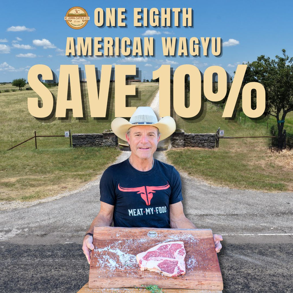 A man in a cowboy hat stands outdoors holding a wooden cutting board with a raw steak, with large promotional text reading 'ONE EIGHTH AMERICAN WAGYU SAVE 10%' and a logo at the top. The shirt he wears shows the brand 'MEAT-MY FOOD'.